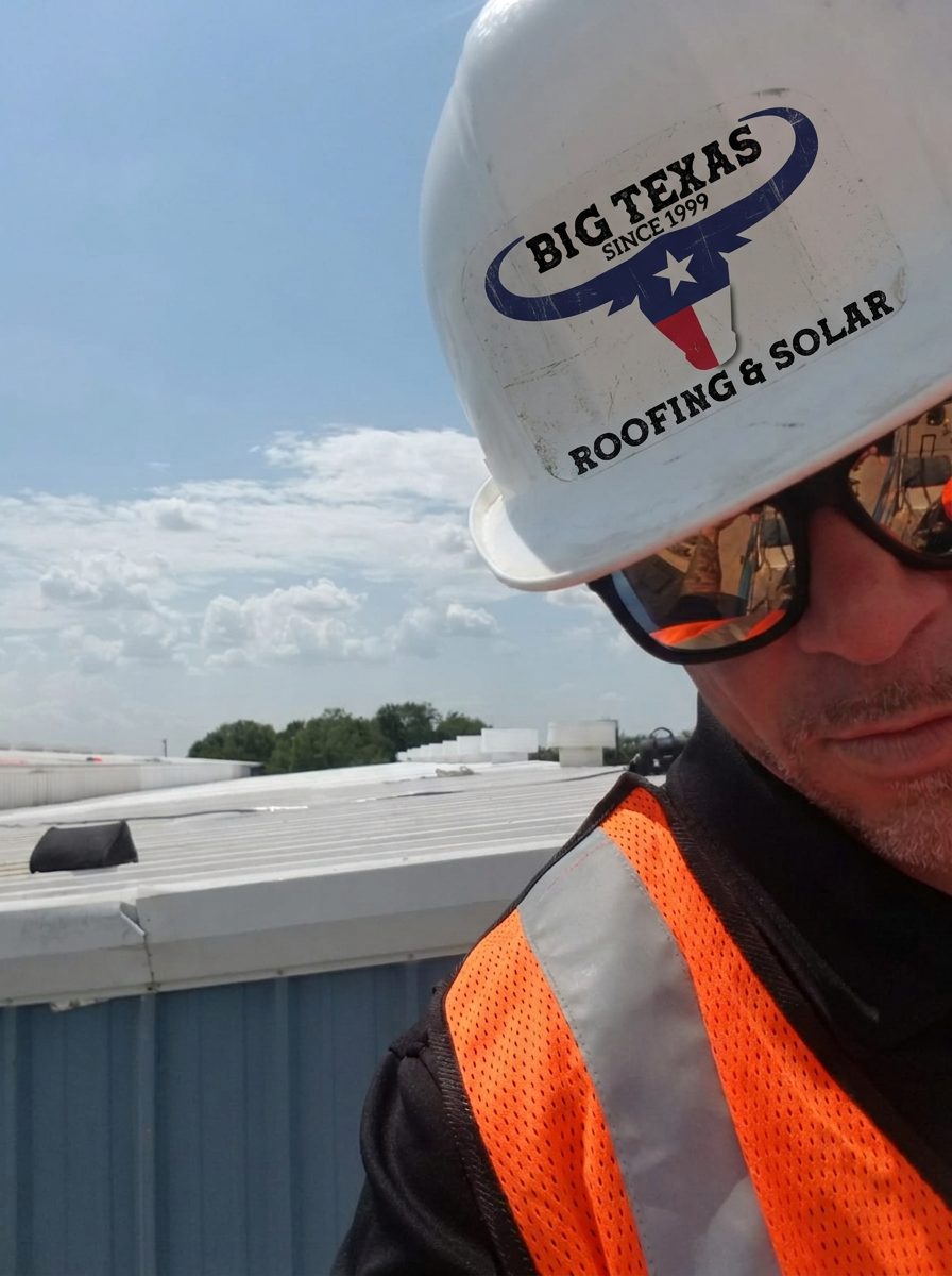 Gold Coast Roofing & Solar owner on the Denver fluid applied roof in hard hat and safety vest