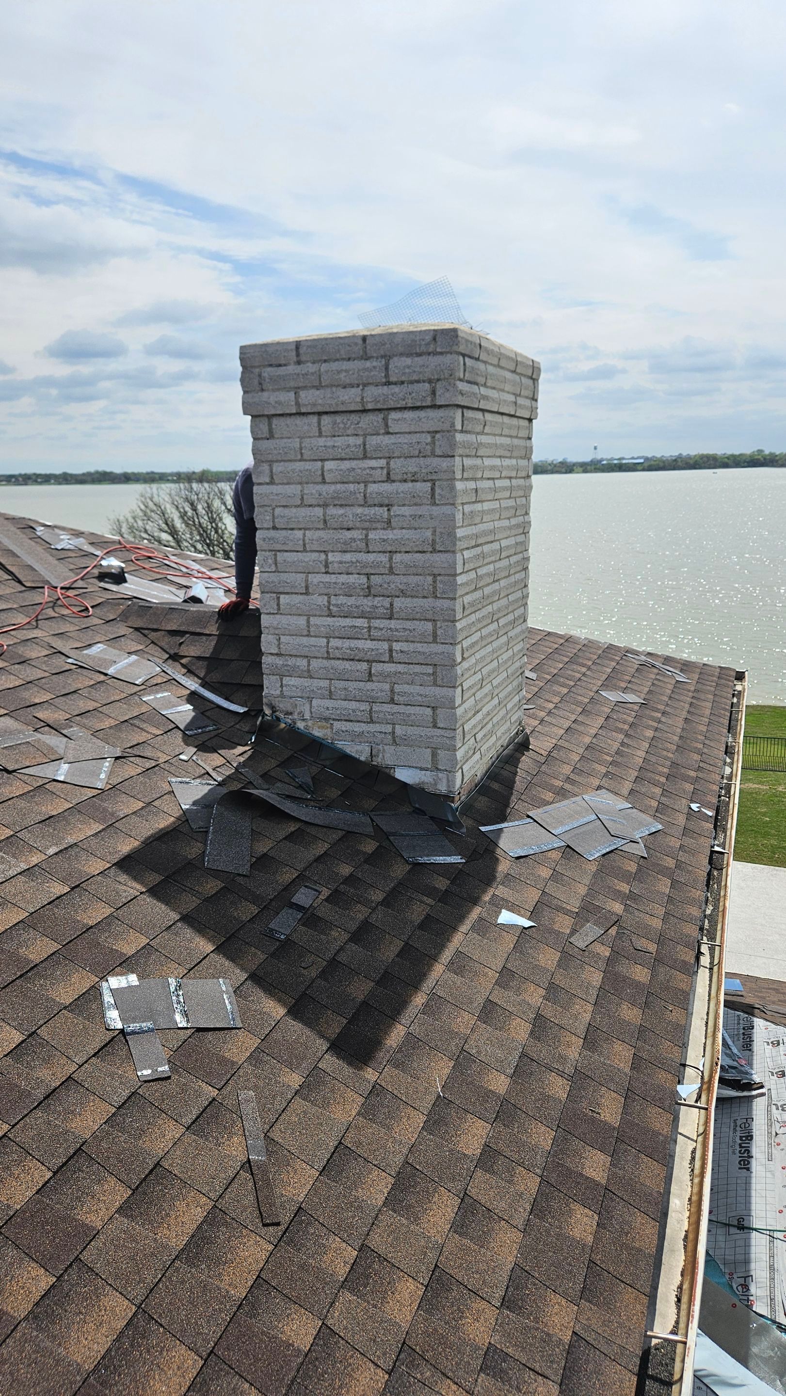Chimney flashing on a shingle roof, Gold Coast Roofing and Solar