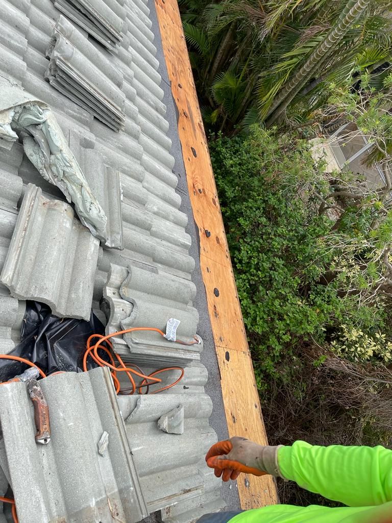 Roof edge decking exposed beside concrete tiles, Gold Coast Roofing and Solar
