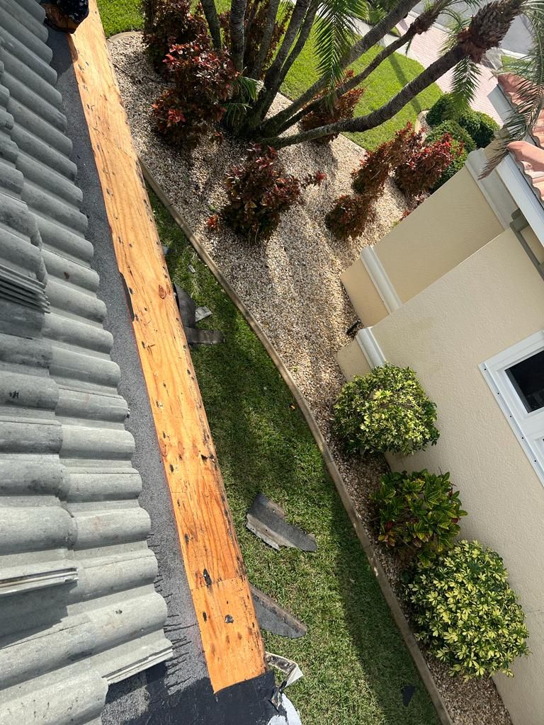Replacement decking along a tile roof edge, Gold Coast Roofing and Solar