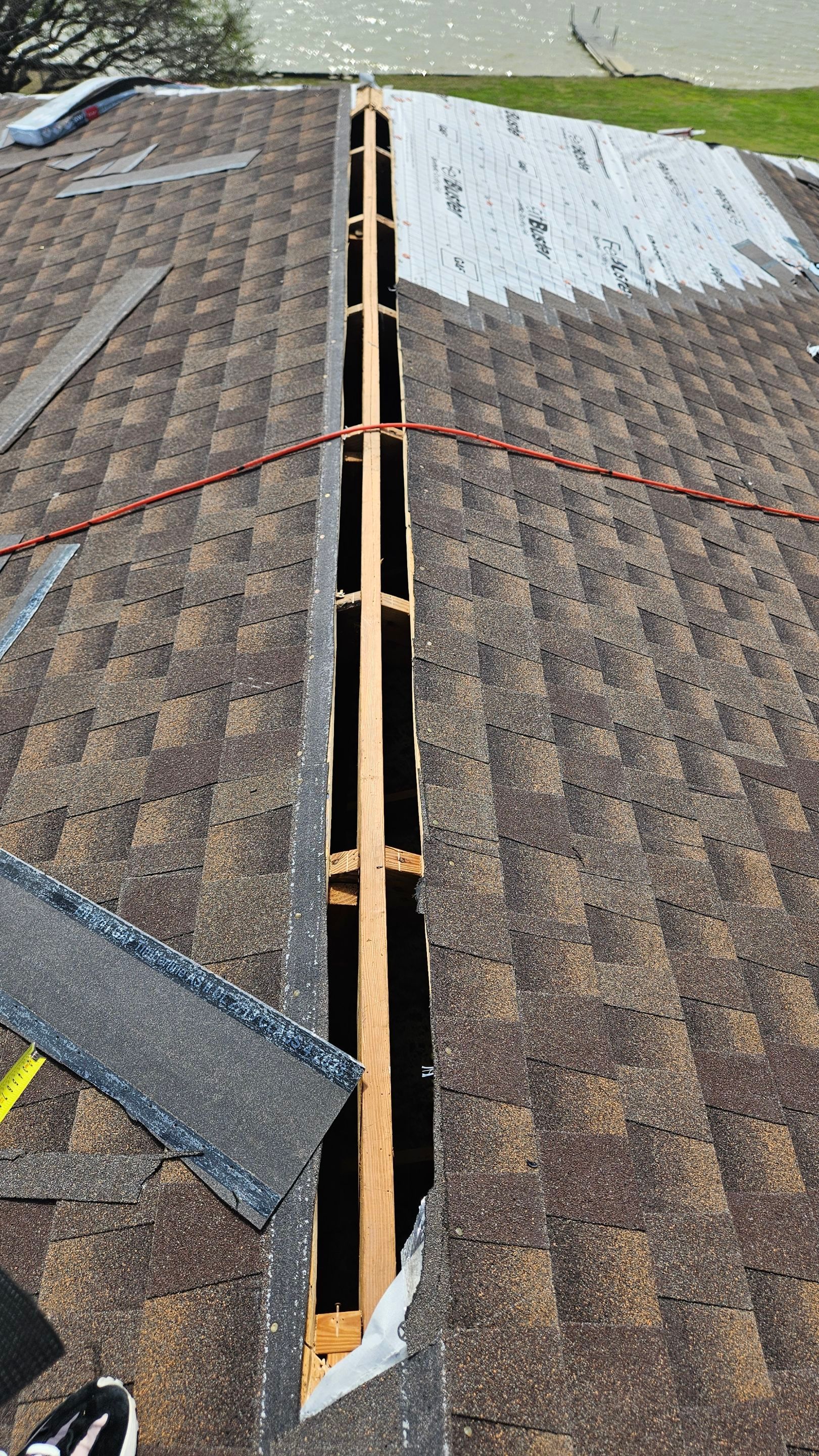 Tile roof opened along a repair area, Gold Coast Roofing and Solar