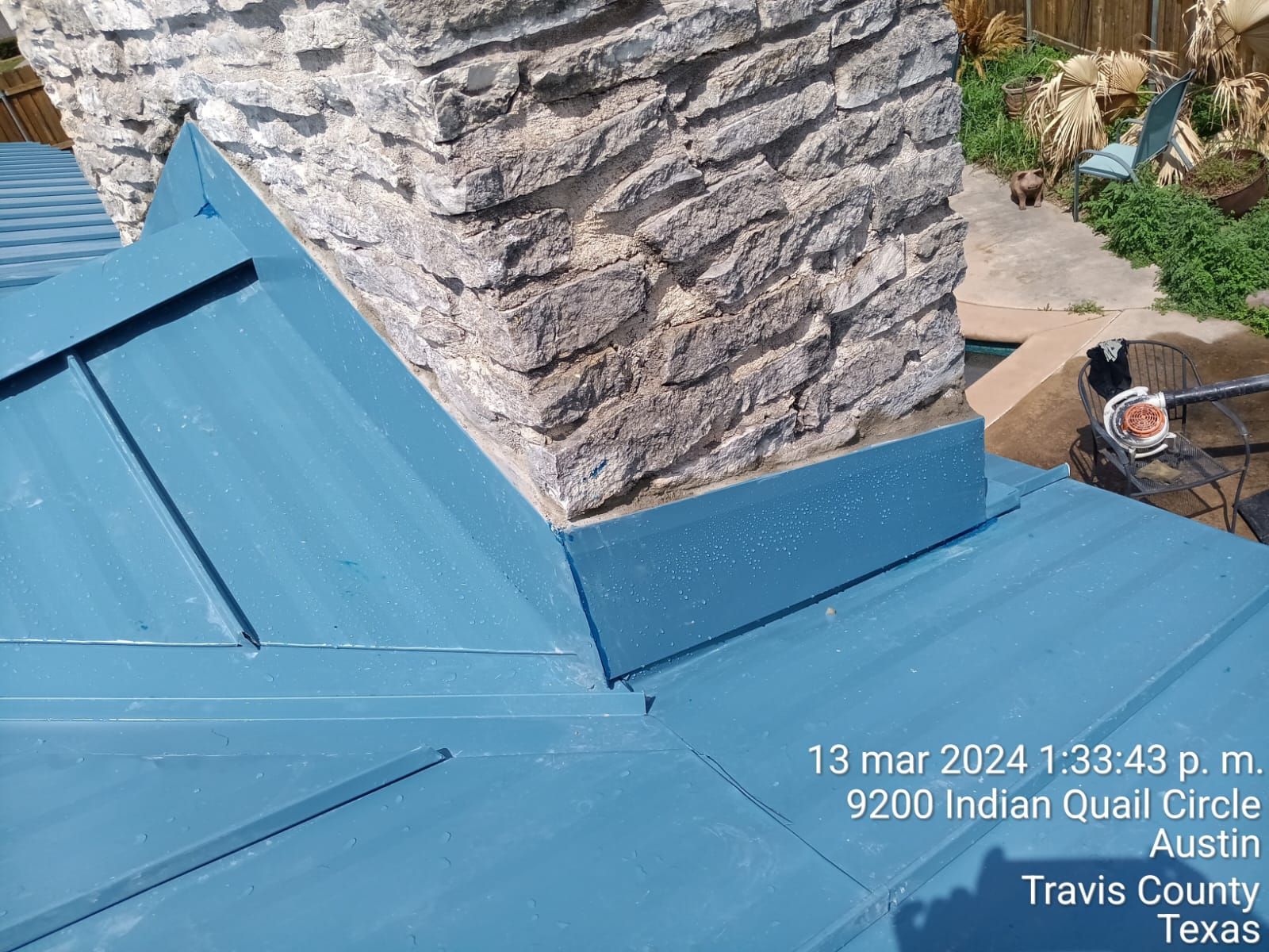 Flashing around the base of a stone chimney, Gold Coast Roofing and Solar