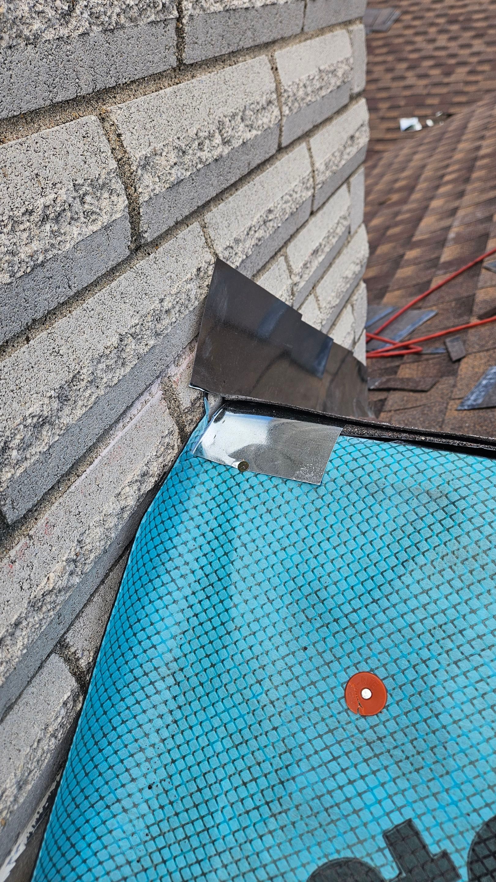 Underlayment fitted around a chimney base, Gold Coast Roofing and Solar