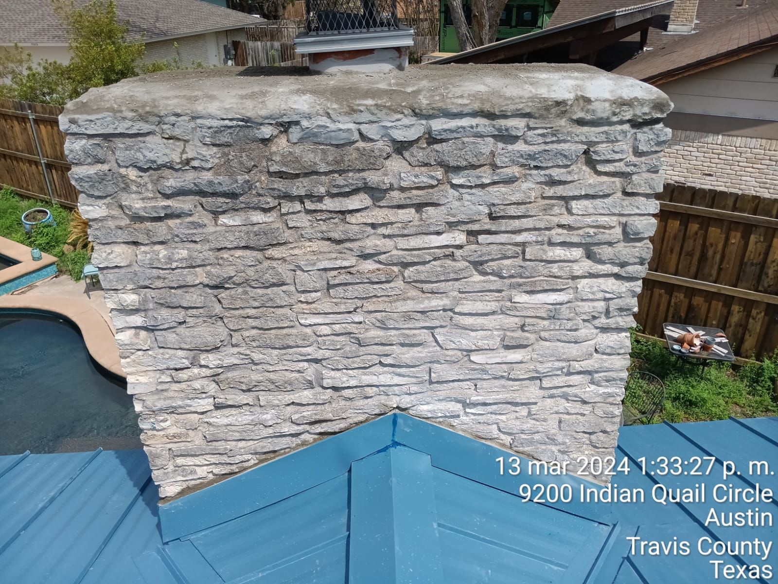 Chimney flashing beside a metal roof, Gold Coast Roofing and Solar