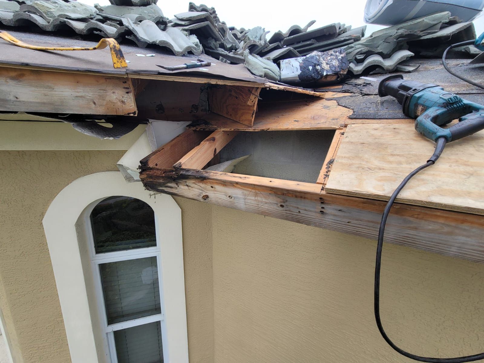 Exposed framing below a tile roof edge, Gold Coast Roofing and Solar