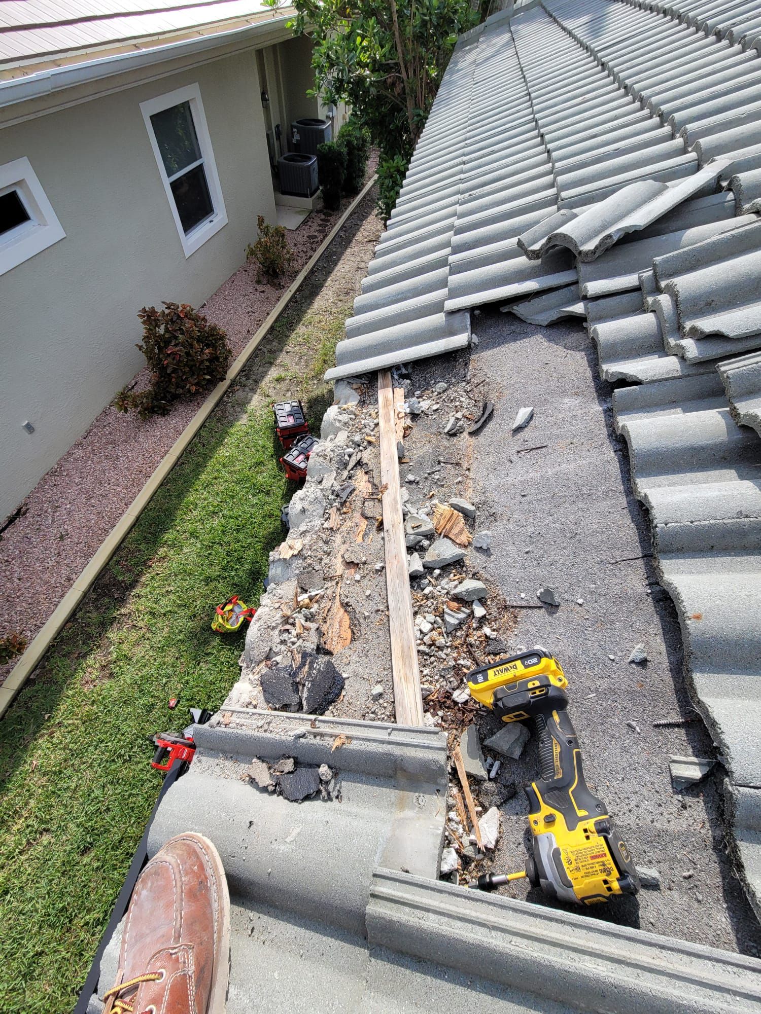 Tools and removed tiles staged for roof repairs, Gold Coast Roofing and Solar