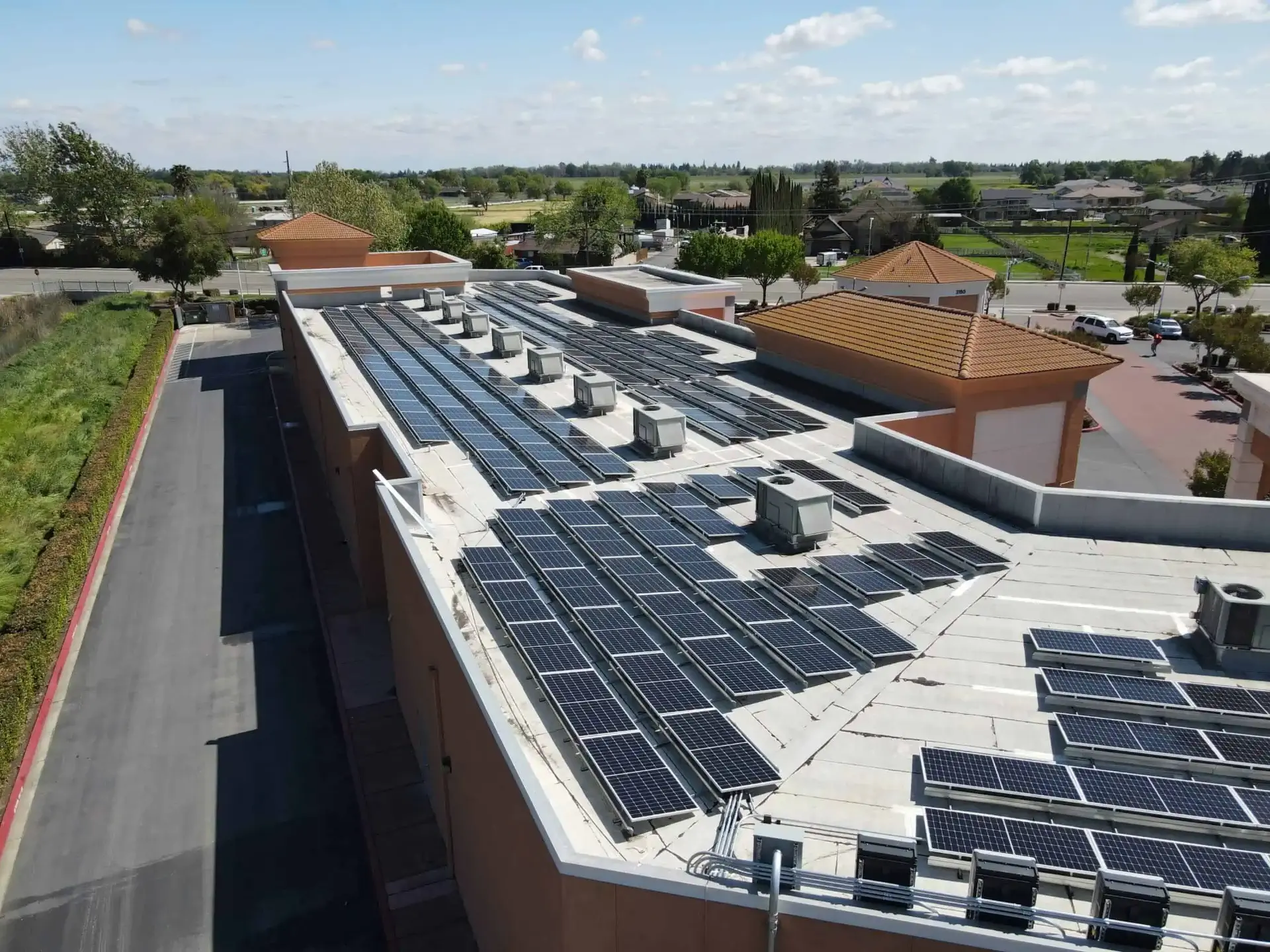 Aerial view of a completed commercial rooftop solar array
