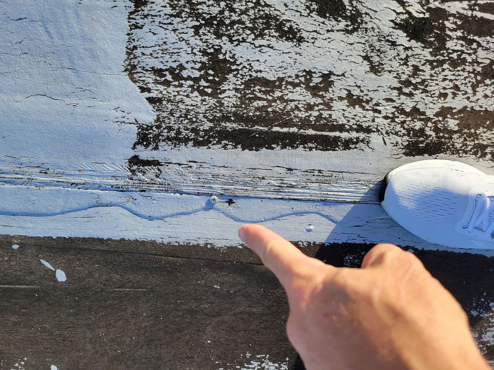 Pointing out a failed seam during pull testing, Atlantis Bahamas