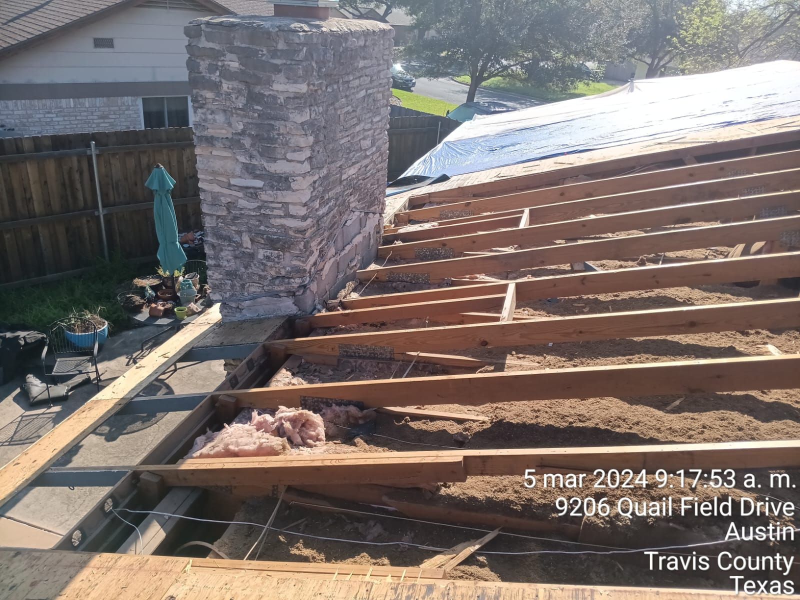 Exposed roof framing beside a chimney, Gold Coast Roofing and Solar