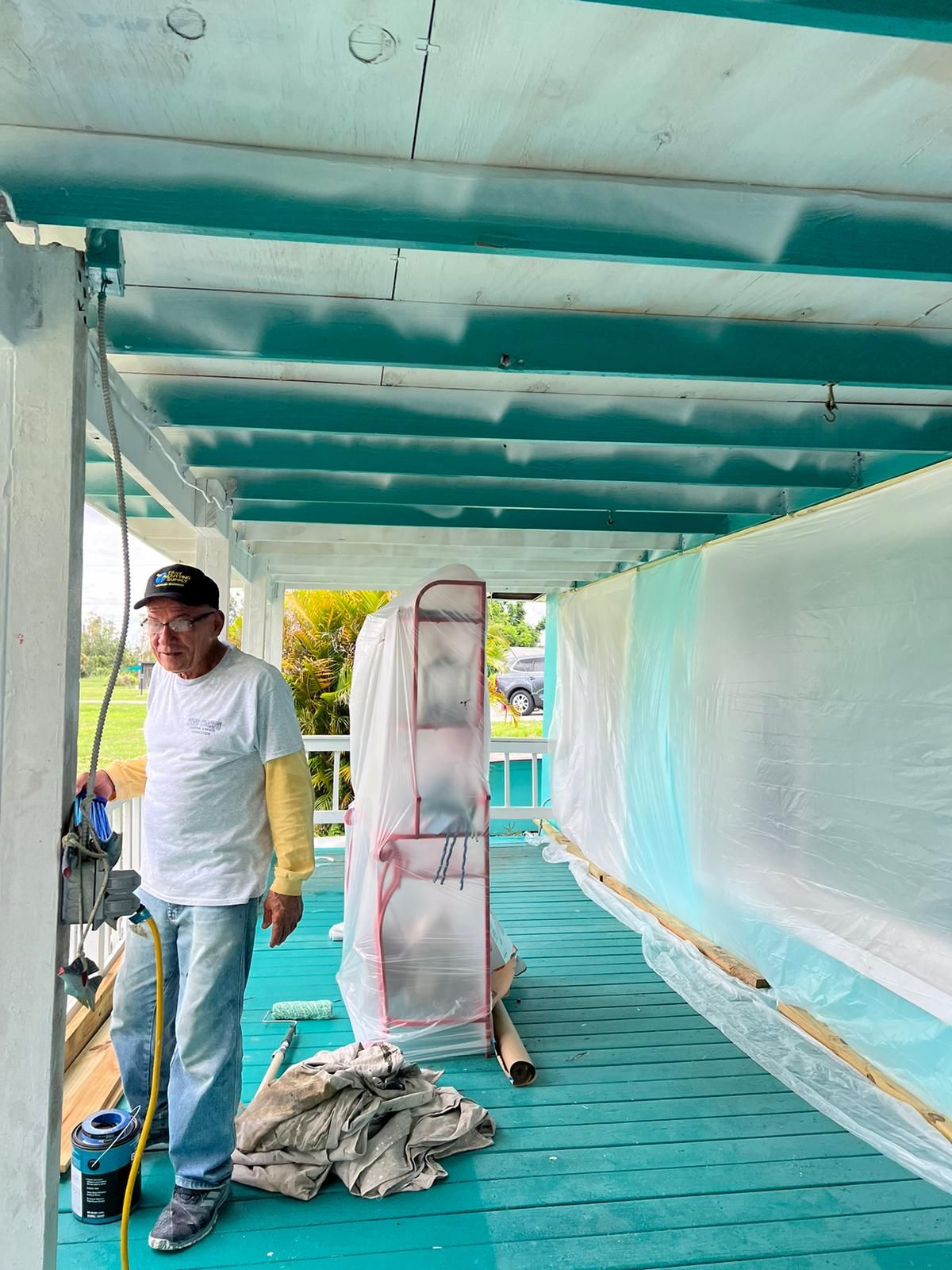 Crew working on a protected exterior ceiling, Gold Coast Roofing and Solar
