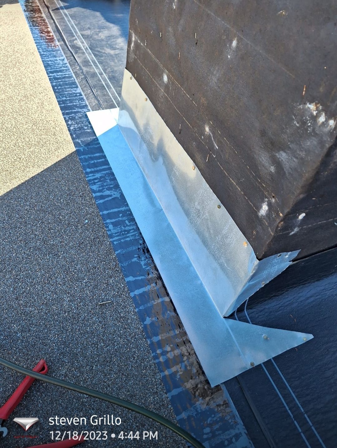 Chimney flashing detail on a shingle roof, Gold Coast Roofing and Solar