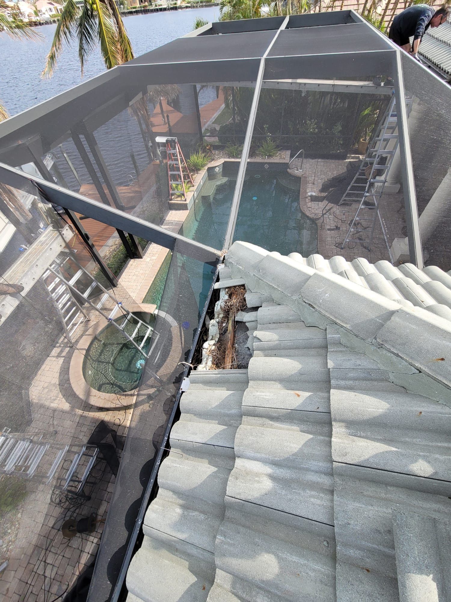 Roof repair work above a screened enclosure, Gold Coast Roofing and Solar